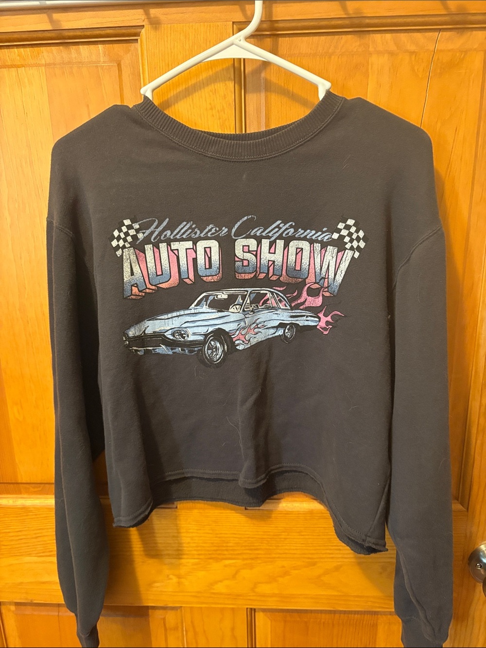 Hollister Black Cropped Sweatshirt with Blue Car Graphic and Pink Flames